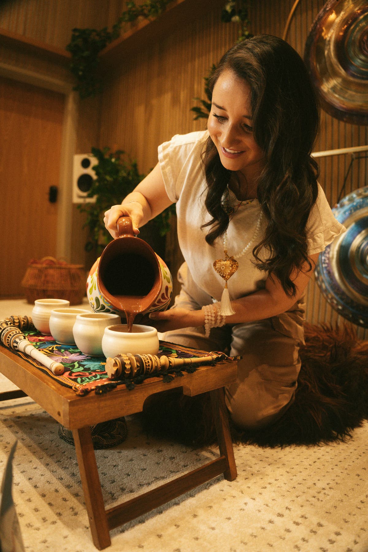 Ceremonial cacao preparation in candlelight