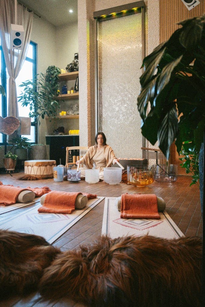 The Zen Garden studio set for a sound session, mats and instruments laid out under soft daylight